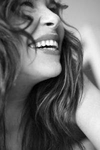 A closeup of a woman laughing