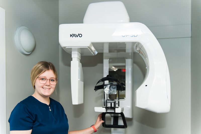 A Rule Dentistry team member with a CBCT scanner